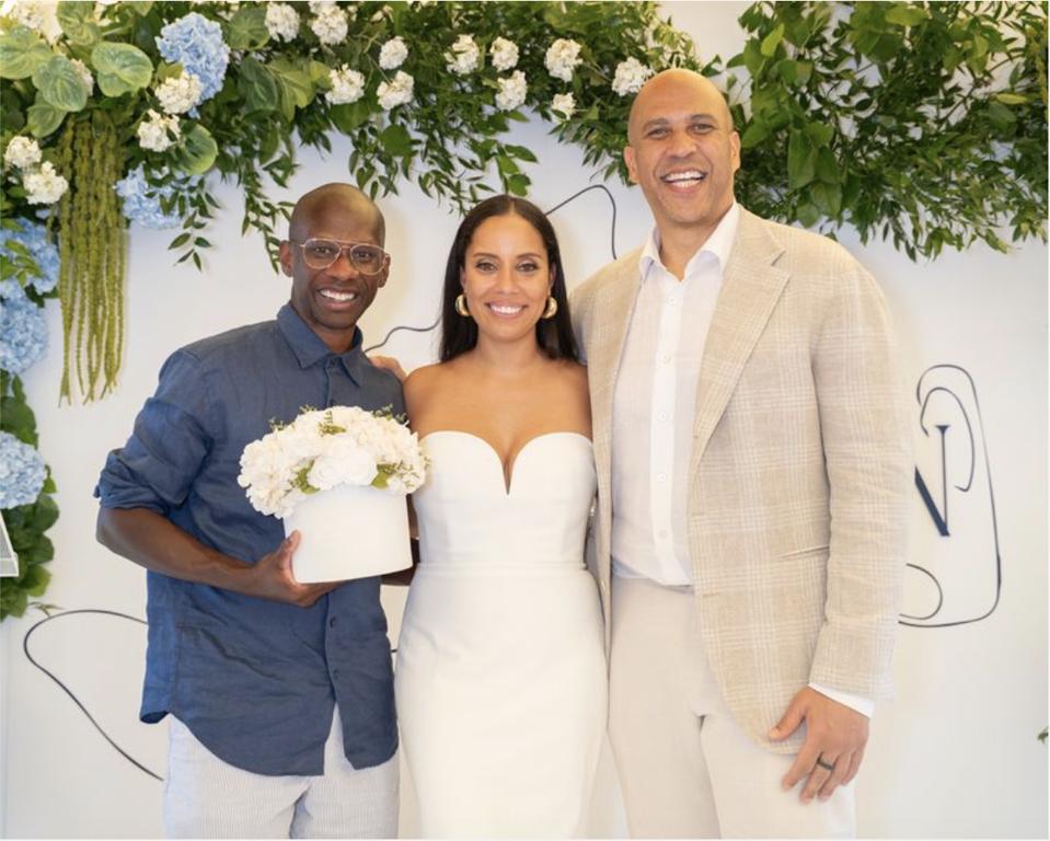Erin Goldson, Troy Carter, and Senator Cory Booker on stage